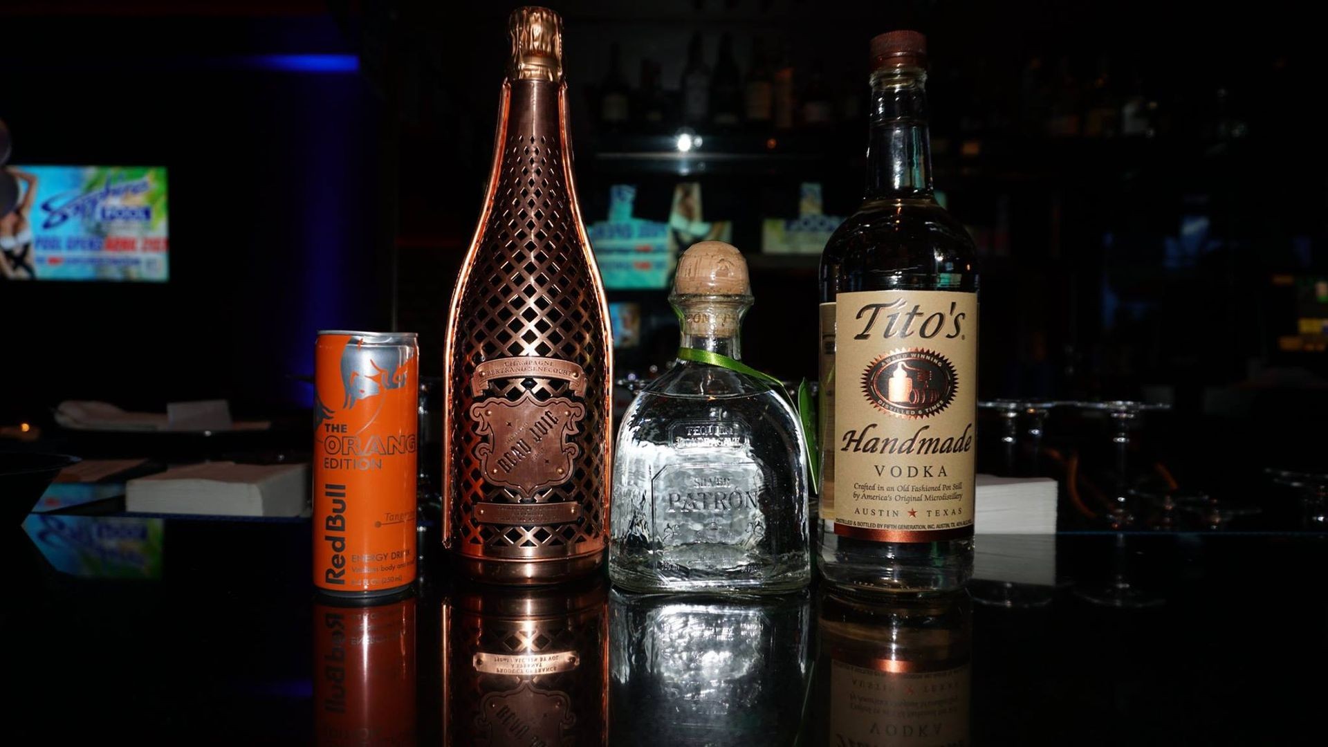 Premium bottle service package at Las Vegas strip clubs, featuring exclusive cocktails and VIP treatment for California guests.